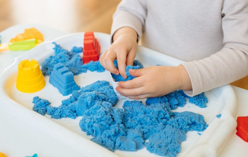 Sand is a great Montessori toy for 4 year olds